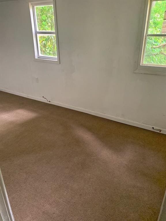 unfurnished room with carpet flooring