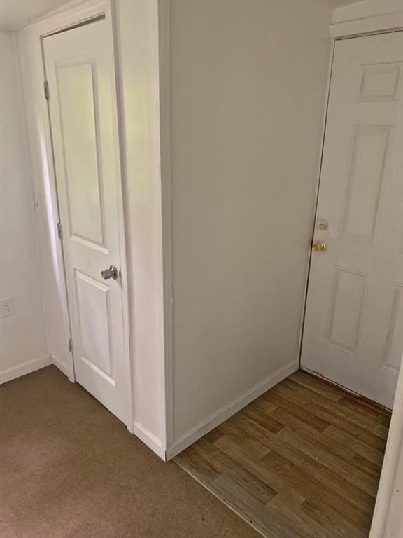 hall featuring dark hardwood / wood-style floors