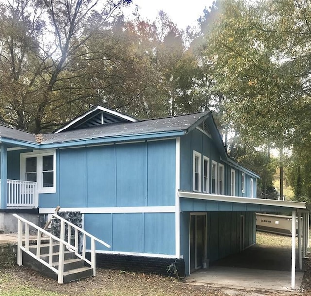 view of property exterior with a carport