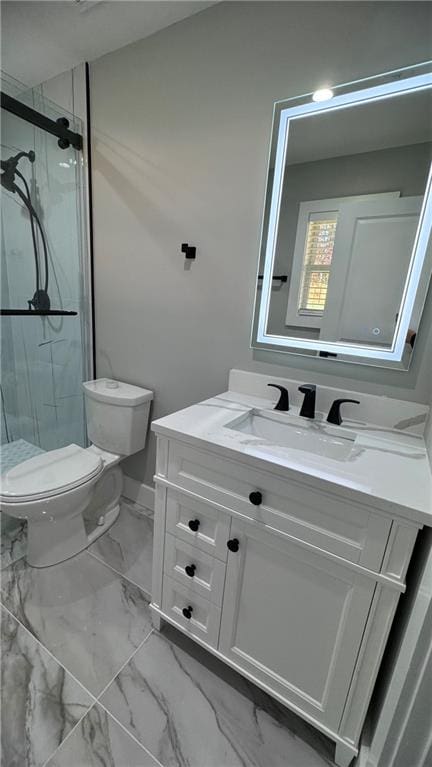 bathroom with vanity, toilet, and an enclosed shower