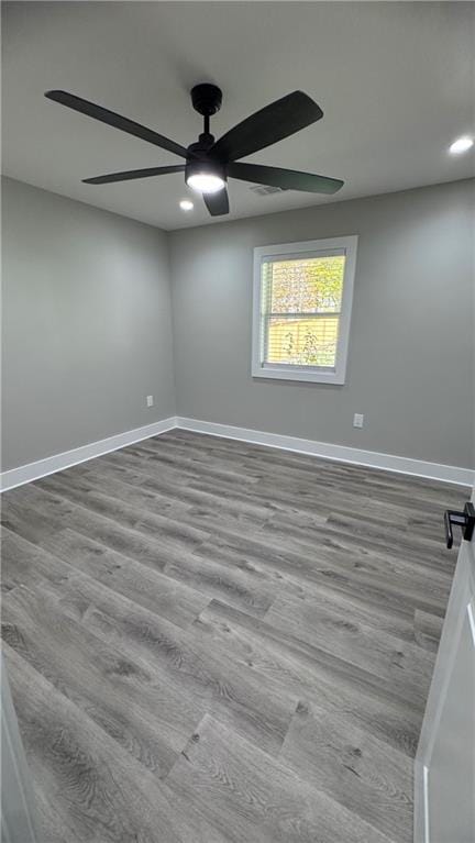 unfurnished room featuring ceiling fan and light hardwood / wood-style floors