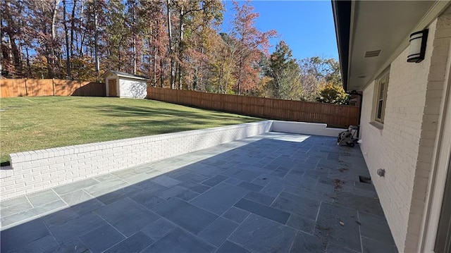 view of patio featuring a storage unit