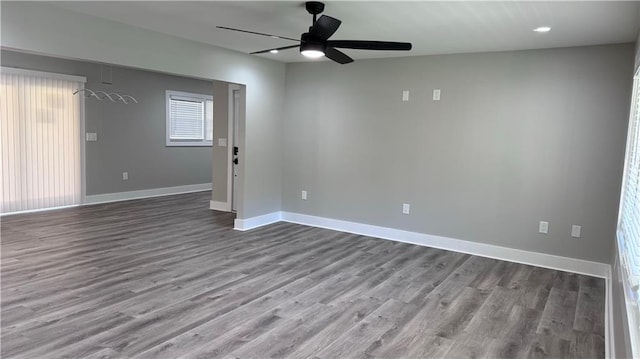 empty room featuring ceiling fan and wood-type flooring