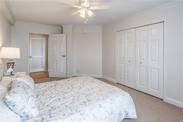 bedroom featuring baseboards, carpet floors, and ornamental molding