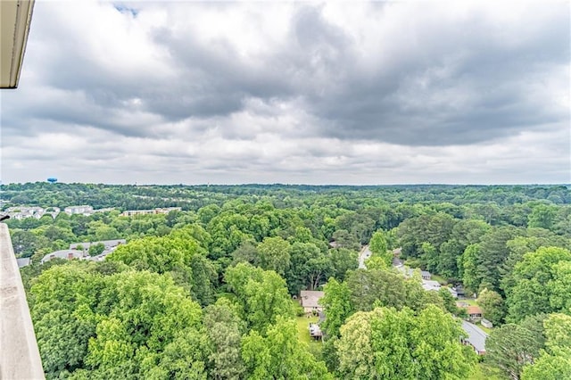 aerial view featuring a wooded view