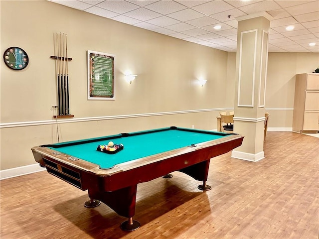 game room with wood finished floors, baseboards, and a paneled ceiling