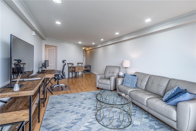 living area with recessed lighting, wood finished floors, and ornamental molding