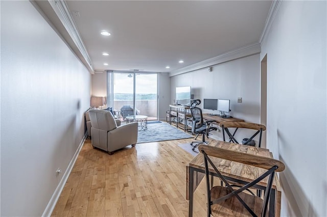 living room featuring recessed lighting, baseboards, light wood-style flooring, and crown molding