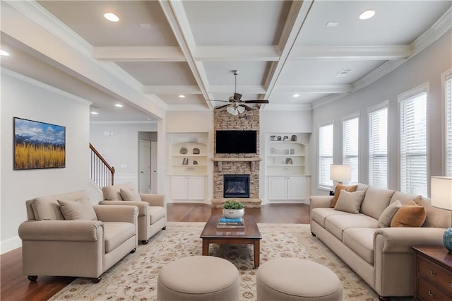 4240 Summer Breeze Way, Buford, GA 30518 - living area featuring wood finished floors, a ceiling fan, beamed ceiling, ornamental molding, and recessed lighting