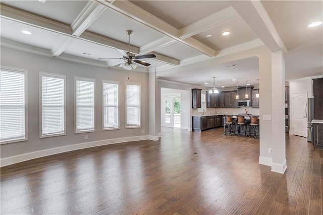 4240 Summer Breeze Way, Buford, GA 30518 - living area featuring a ceiling fan, beam ceiling, dark wood-style flooring, coffered ceiling, and baseboards