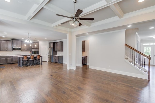 4240 Summer Breeze Way, Buford, GA 30518 - living room with dark wood-type flooring, a ceiling fan, coffered ceiling, a chandelier, and stairway
