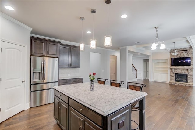 4240 Summer Breeze Way, Buford, GA 30518 - kitchen with stainless steel fridge, a ceiling fan, light countertops, dark brown cabinets, and dark wood-style floors