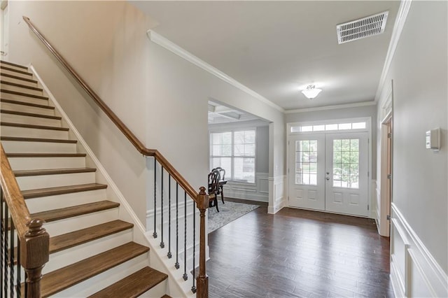 4240 Summer Breeze Way, Buford, GA 30518 - foyer featuring dark wood-style flooring, a decorative wall, ornamental molding, stairway, and a wainscoted wall