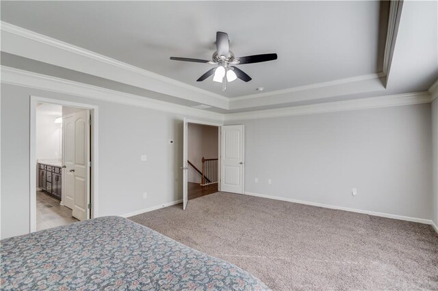 4240 Summer Breeze Way, Buford, GA 30518 - unfurnished bedroom with ornamental molding, a raised ceiling, baseboards, light colored carpet, and ceiling fan