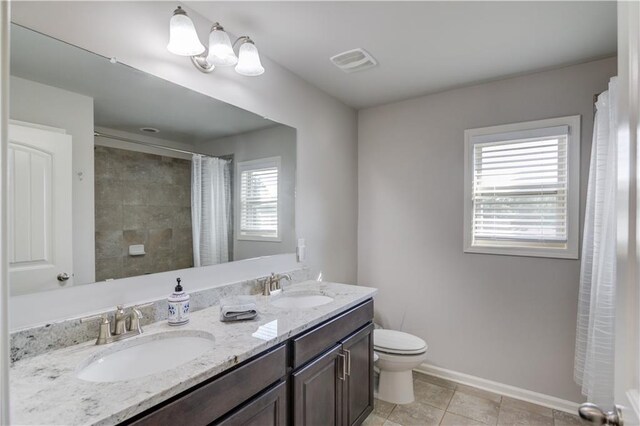 4240 Summer Breeze Way, Buford, GA 30518 - bathroom with toilet, baseboards, double vanity, and a shower with curtain