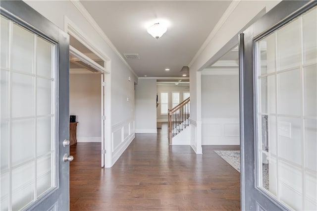 4240 Summer Breeze Way, Buford, GA 30518 - corridor with crown molding, a decorative wall, dark wood finished floors, stairs, and a wainscoted wall
