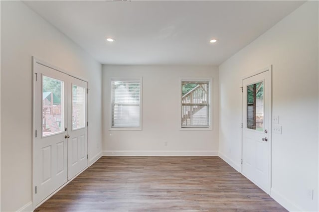 4240 Summer Breeze Way, Buford, GA 30518 - entryway with wood finished floors, recessed lighting, baseboards, and french doors