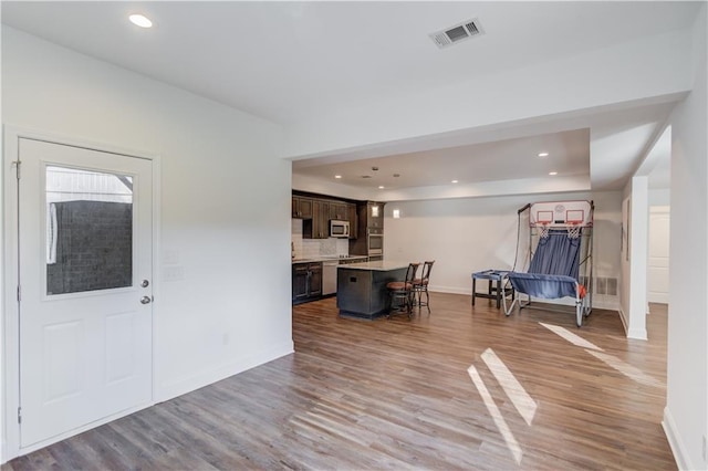 4240 Summer Breeze Way, Buford, GA 30518 - living room featuring baseboards, wood finished floors, and recessed lighting