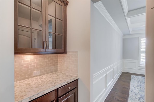 4240 Summer Breeze Way, Buford, GA 30518 - bar area featuring ornamental molding, dark wood finished floors, decorative backsplash, a decorative wall, and a wainscoted wall