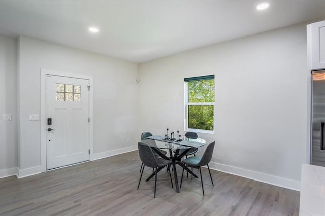 dining area with dark hardwood / wood-style flooring