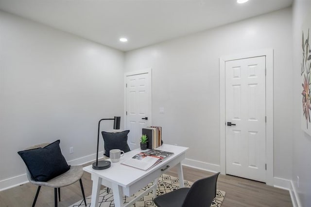 office space with light wood-type flooring