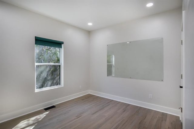 empty room with wood-type flooring