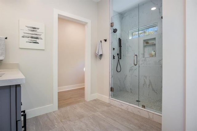 bathroom with vanity and an enclosed shower