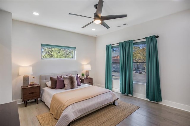 bedroom featuring wood-type flooring and ceiling fan