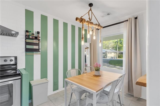 1452 Mercer Ave, Atlanta, GA 30337 - dining room featuring light tile patterned floors and crown molding