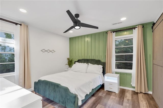 1452 Mercer Ave, Atlanta, GA 30337 - bedroom with wood finished floors, ceiling fan, and recessed lighting
