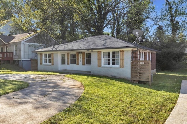1452 Mercer Ave, Atlanta, GA 30337 - view of front of home featuring brick siding, a front lawn, a porch, and crawl space