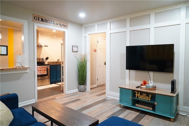 1452 Mercer Ave, Atlanta, GA 30337 - living area featuring light wood-type flooring and recessed lighting