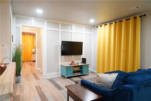 1452 Mercer Ave, Atlanta, GA 30337 - living area featuring light wood-style flooring and recessed lighting