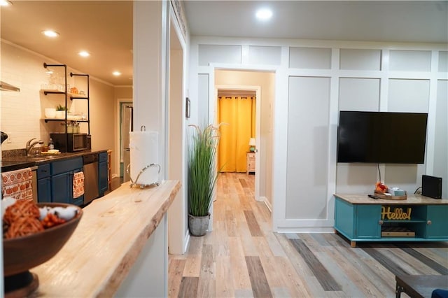 1452 Mercer Ave, Atlanta, GA 30337 - kitchen with blue cabinetry, wooden counters, light wood-style floors, recessed lighting, and open shelves