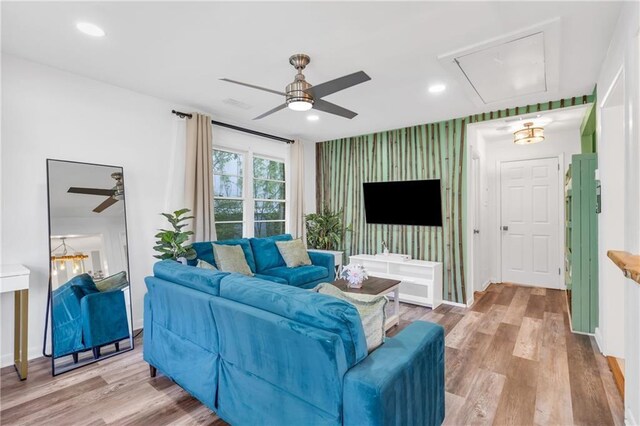 1452 Mercer Ave, Atlanta, GA 30337 - living area with attic access, ceiling fan, an accent wall, wood finished floors, and wallpapered walls