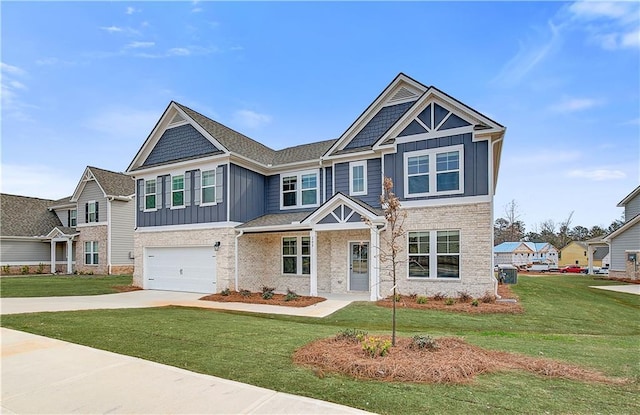 craftsman house with driveway, a front lawn, board and batten siding, and an attached garage