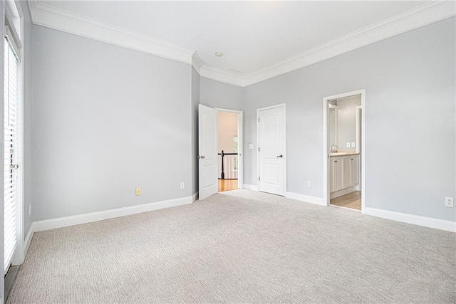 1260 Monroe Dr NE, Atlanta, GA 30306 - unfurnished bedroom with ornamental molding, multiple windows, light colored carpet, and ensuite bath