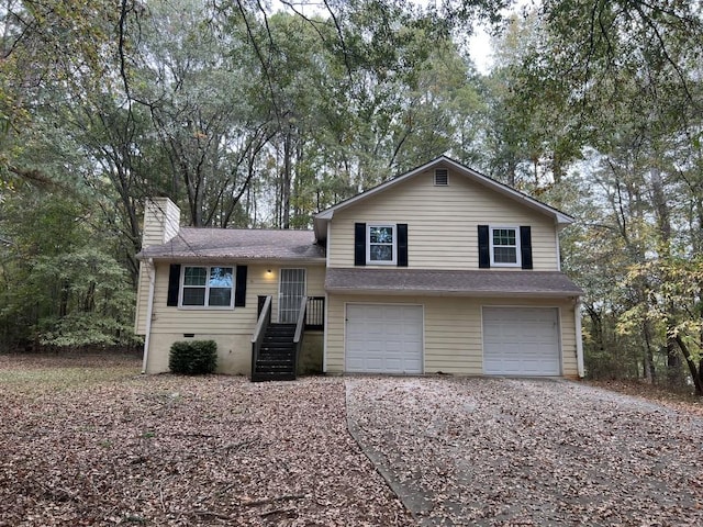 split level home featuring a garage