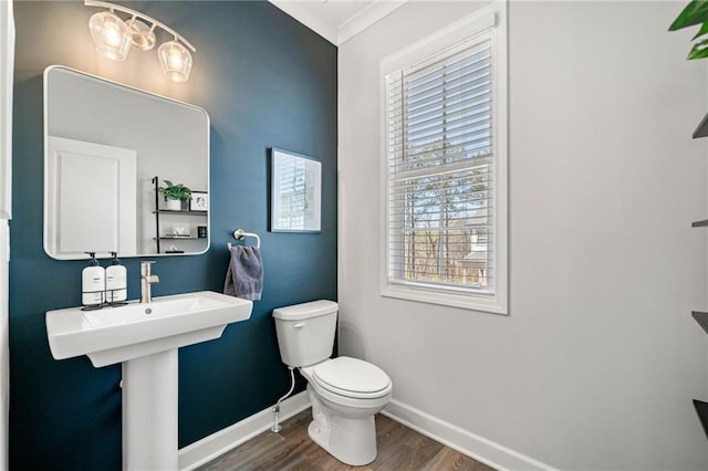 234 Retreat Ln, Canton, GA 30114 - half bathroom with wood finished floors, baseboards, toilet, healthy amount of natural light, and ornamental molding
