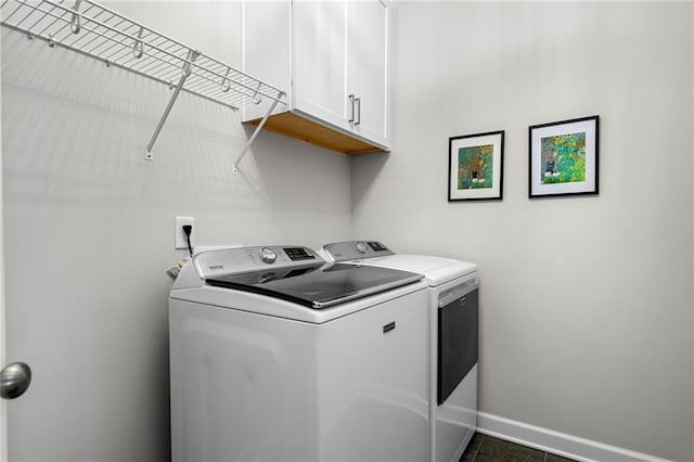 234 Retreat Ln, Canton, GA 30114 - washroom featuring washing machine and dryer, cabinet space, and baseboards
