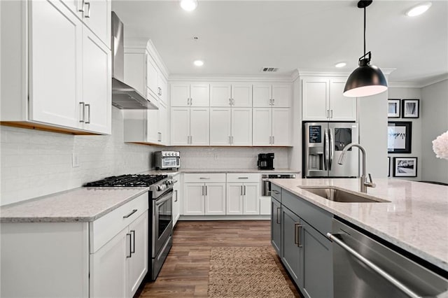 234 Retreat Ln, Canton, GA 30114 - kitchen with appliances with stainless steel finishes, wall chimney exhaust hood, a sink, gray cabinets, and white cabinets