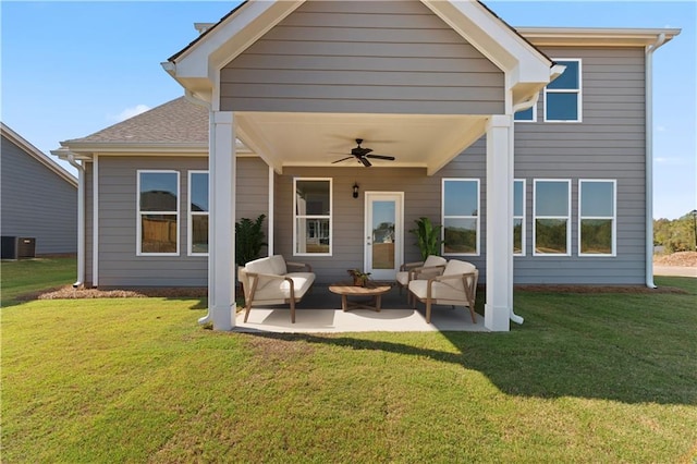 rear view of house featuring ceiling fan, a yard, outdoor lounge area, central air condition unit, and a patio area