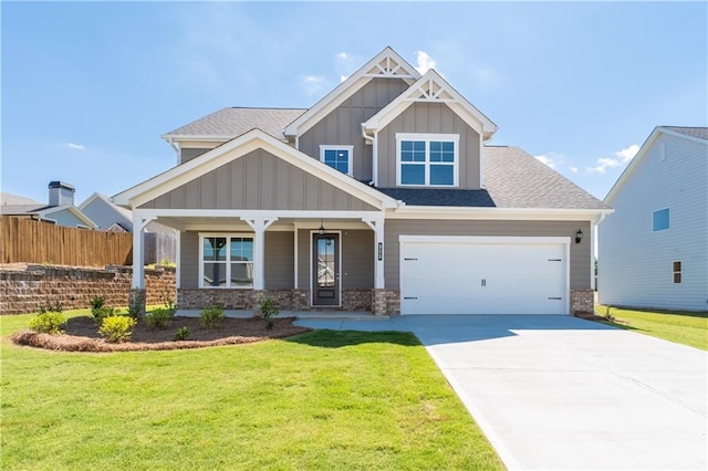 craftsman-style house featuring a front yard and covered porch