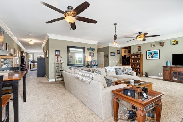 carpeted living area with ceiling fan and ornamental molding