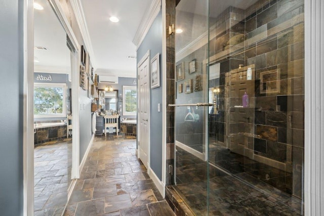 bathroom with vanity, stone tile floors, baseboards, ornamental molding, and a stall shower
