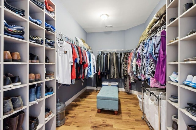 spacious closet with visible vents and wood finished floors