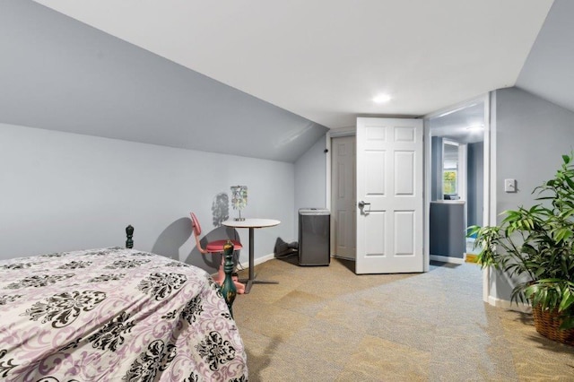 bedroom with light colored carpet, baseboards, and lofted ceiling