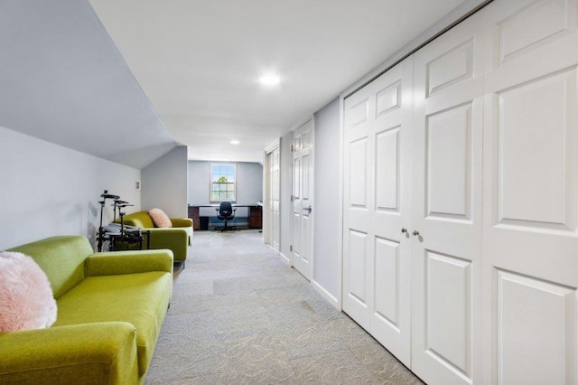 hallway featuring baseboards, carpet flooring, recessed lighting, and lofted ceiling