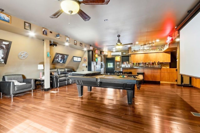 recreation room featuring visible vents, wood finished floors, ceiling fan, pool table, and a community bar