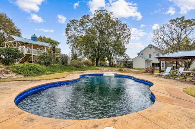 outdoor pool featuring a gazebo and a patio area
